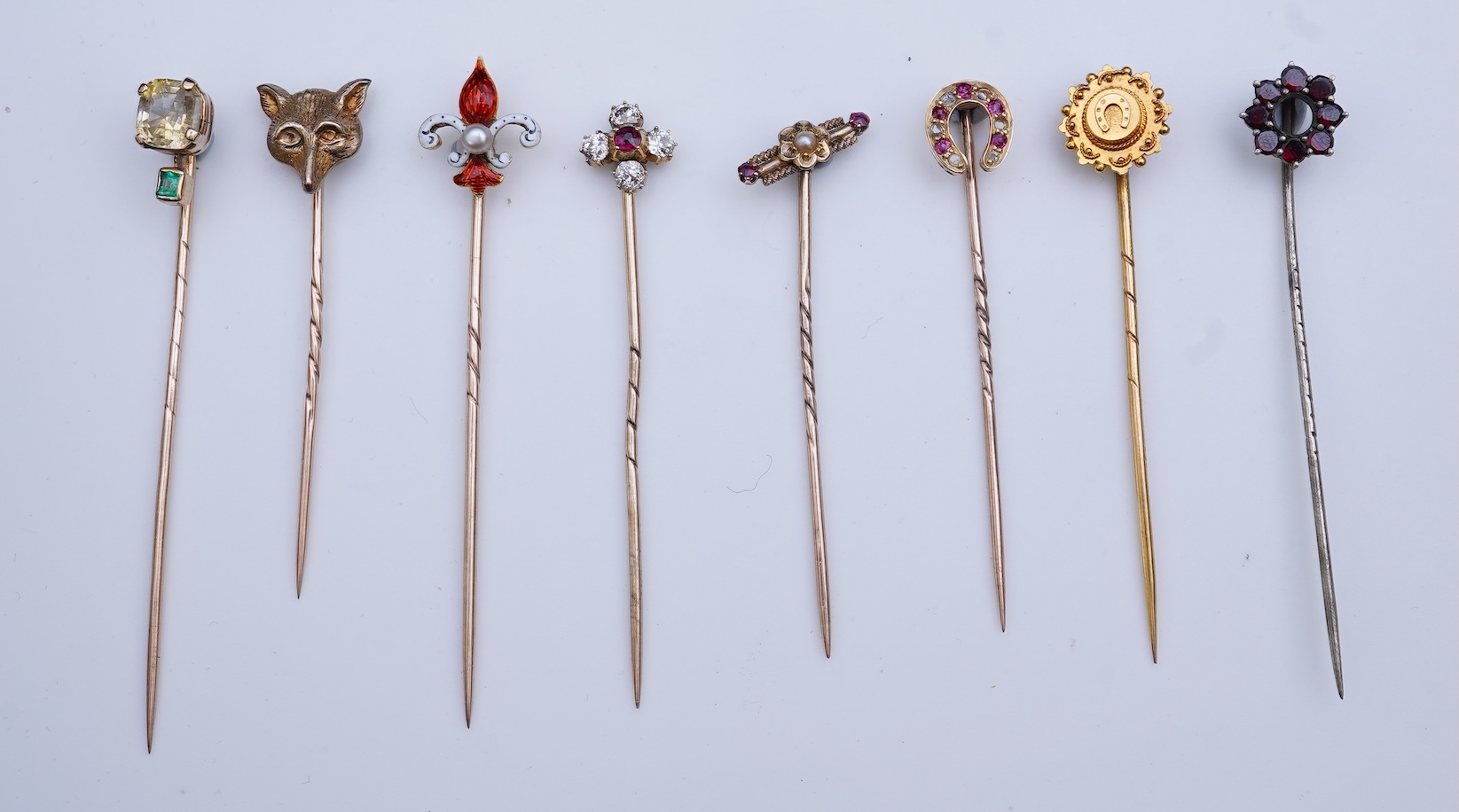 A collection of eight tie pins, 19th and 20th century